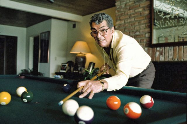 The comedian playing pool at his Beverly Hills home