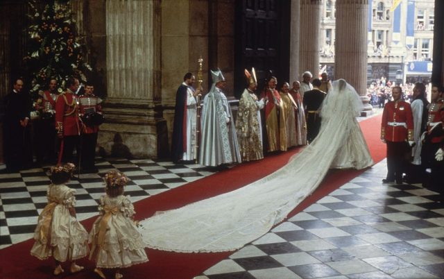 Two little girls carrying Princess Diana's wedding train as she exits St. Paul's Cathedral