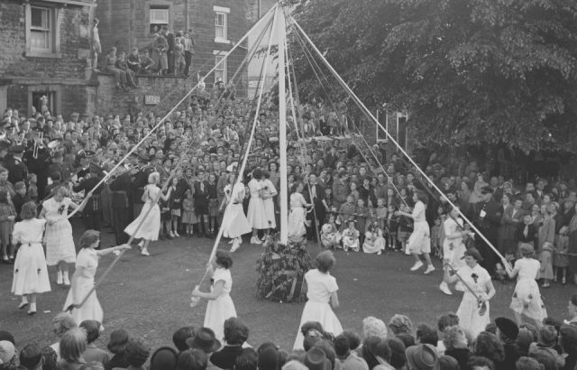 School children dancing around a maypole