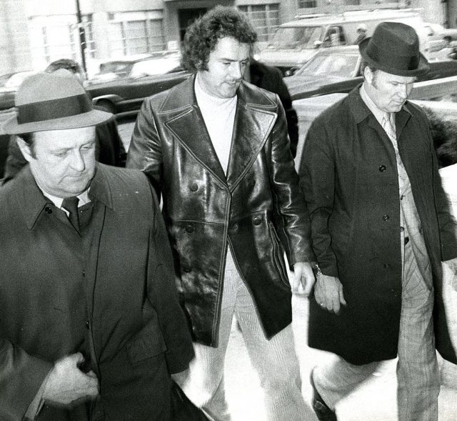Mobster Francis Salemme flanked by two men in suits