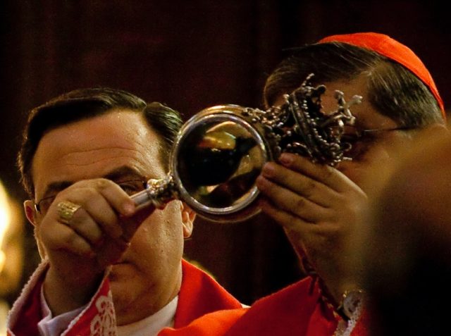Cardinal Crescenzio Sepe displays the liquid blood of Januarius.