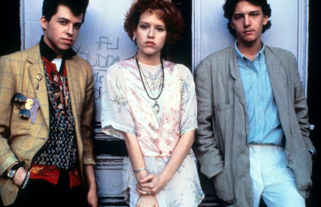 Jon Cryer, Molly Ringwald and Andrew McCarthy standing beside each other 