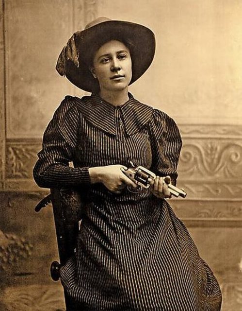 Female prisoner posing as Rose Dunn with a gun