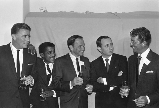 The five members of the Rat Pack standing side-by-side in suits