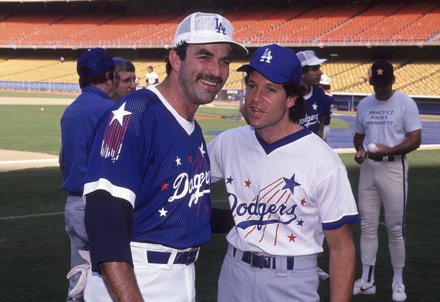 Tom Selleck and Steve Guttenberg posing for a picture