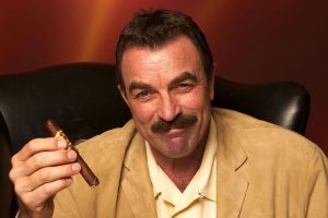 Tom Selleck holding a cigar