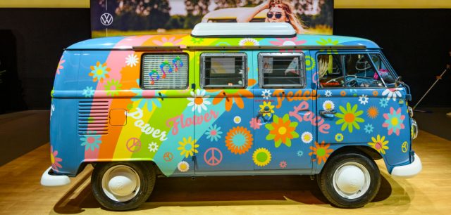 Volkswagen camper van decorated with symbols of the hippie movement
