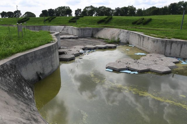 Manmade waterway containing algae-filled water