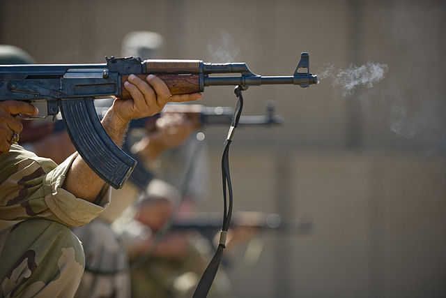 Soldier firing an AK-47