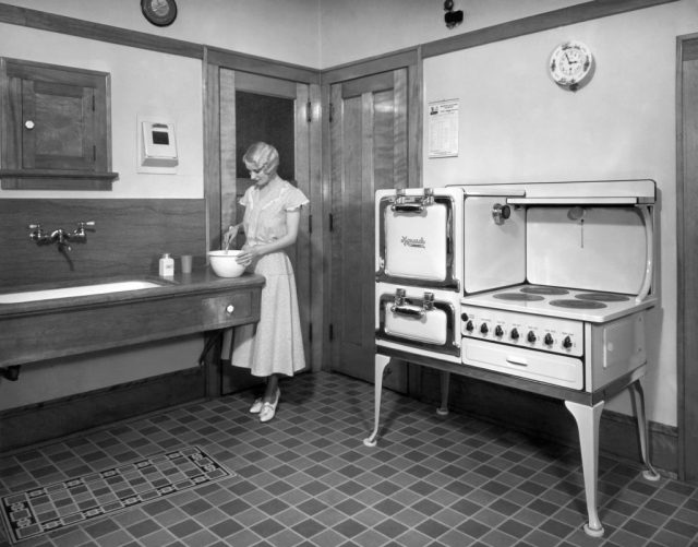 Woman stirring a bowl at a kitchen counter