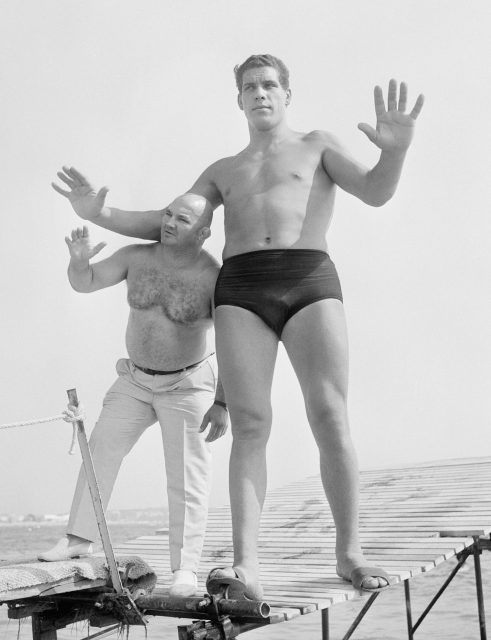 Andre the Giant (right), age 19, standing beside French wrestler Cheri-Bibi (left). (Photo Credit: Universal/ Getty Images)