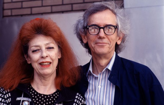 Portrait of married artists Jeanne-Claude (1935 – 2009) and Christo as they pose together at the Harlem School of the Arts, New York, New York, April 26, 1997. (Photo Credit: Rita Barros/Getty Images)