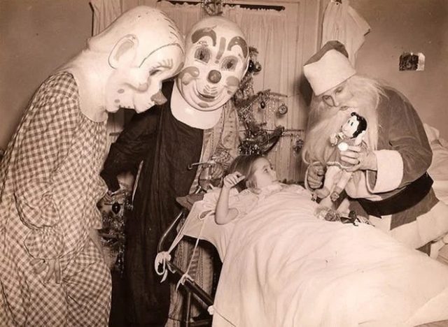 clowns and Santa visiting a sick girl in 1950s 