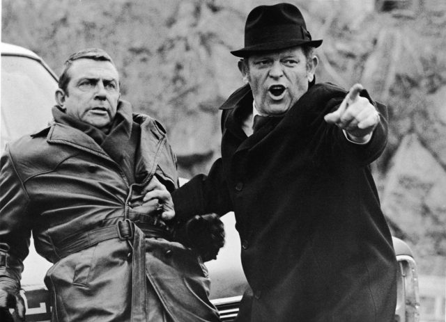 Eddie Egan (right) holds back American actor Bill Hickman from fighting in a still from the film ‘The French Connection,’ directed by William Friedkin, 1971. (Photo Credit: 20th Century Fox/Courtesy of Getty Images)