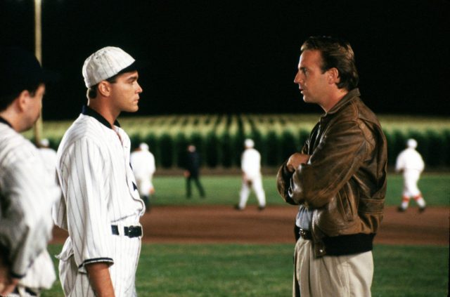 Ray Liotta and Kevin Costner standing on a baseball diamond