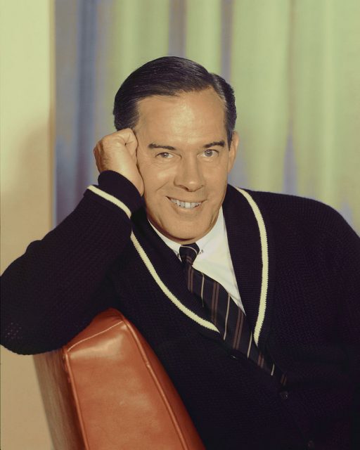 Harry Morgan posing on a leather chair