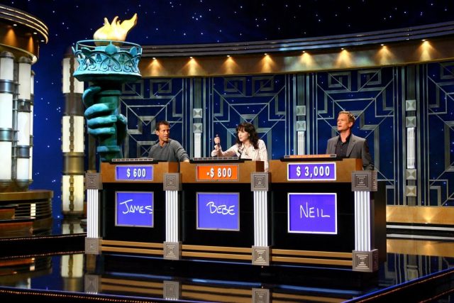 Jeopardy! contestants pressing their buzzers