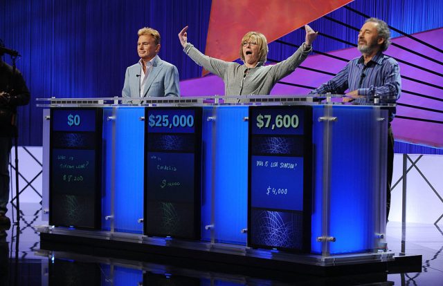 Jane Curtin celebrating her Jeopardy! win behind the podium
