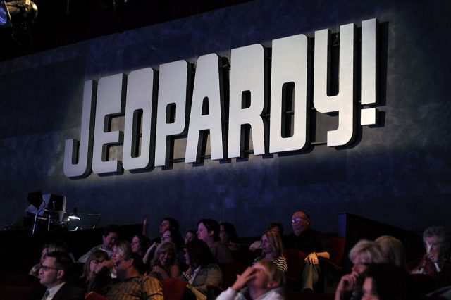 Jeopardy! logo over the studio audience