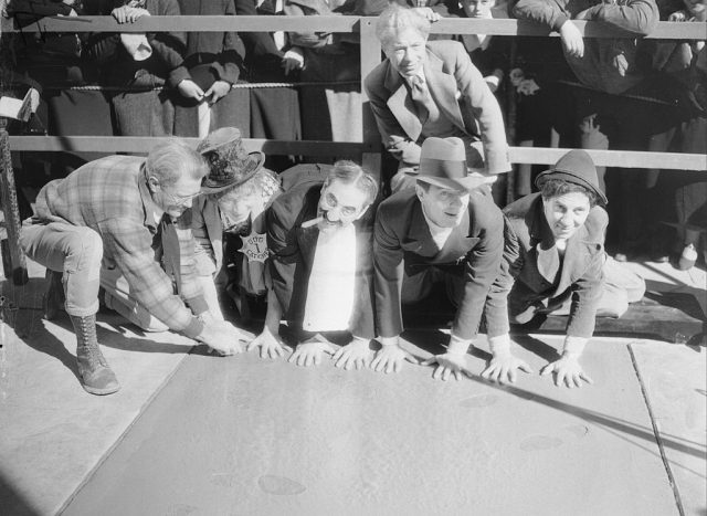 X Marx the Spot. Hollywood, California: Caught hands down are the four Marx Brothers of film fame as they leave their fingerprints for posterity or something at Grauman’s Chinese Theater in Hollywood, California. Left to right, Harpo, Groucho, Zeppo, and Chico Marx. (Photo Credit: Bettmann / Contributor)