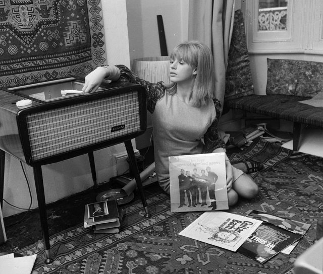 15th October 1964: Marianne Faithfull playing records at her home