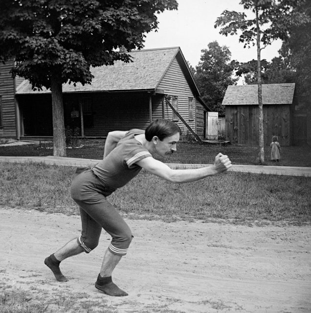 Victorian athlete striking a running pose