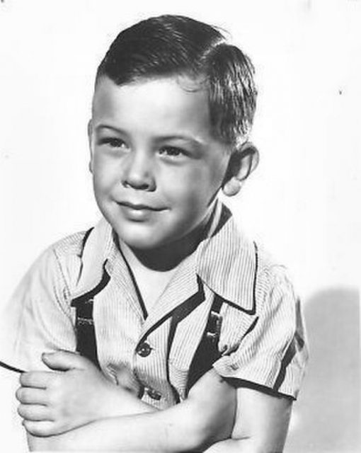 Bobby Driscoll with his arms crossed