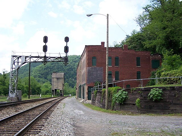 Csx railroad running alongside a brick building