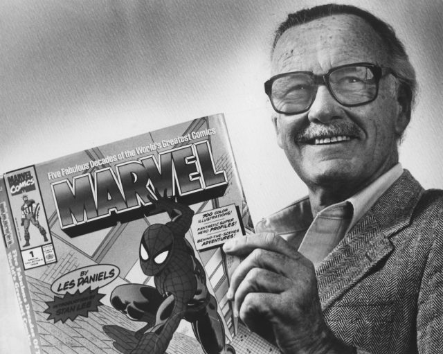 Marvel comics publisher, stan lee, poses with a book of “spider man” comics which he created along with comics on the “hulk” and others. Photo from washington post archive scanned on 2/17/2009. (photo credit: gerald martineau/the washington post via getty images)