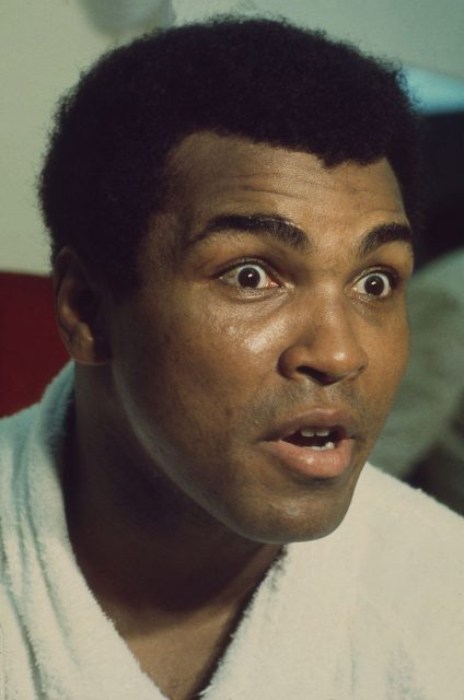 Heavyweight Boxing Champion Muhammad Ali looks surprised at break in training ringside (Photo Credit: Nik Wheeler/Corbis via Getty Images)