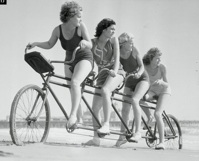 Mary Dodd, Evelyn Crow, Marilyn Dawson and Merle Crow on a bicycle built for four at Venice, CA. (Photo Credit: Bettmann / Contributor)