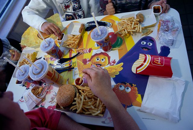 Food atop a table featuring mcdonald's characters