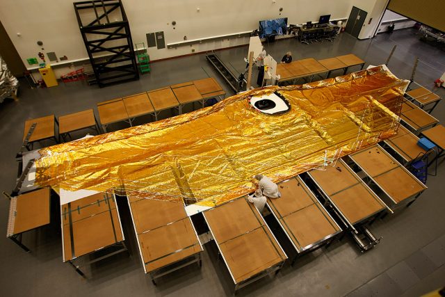 James Webb Space Telescope folding mirror covered in gold foil