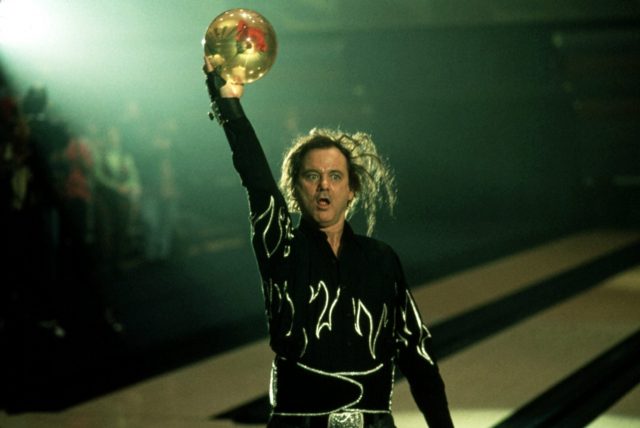 Ernie McCracken holding up a bowling ball
