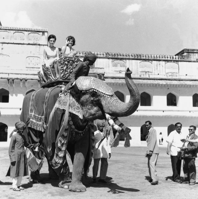 Jackie Kennedy and Lee Radziwill riding an elephant 