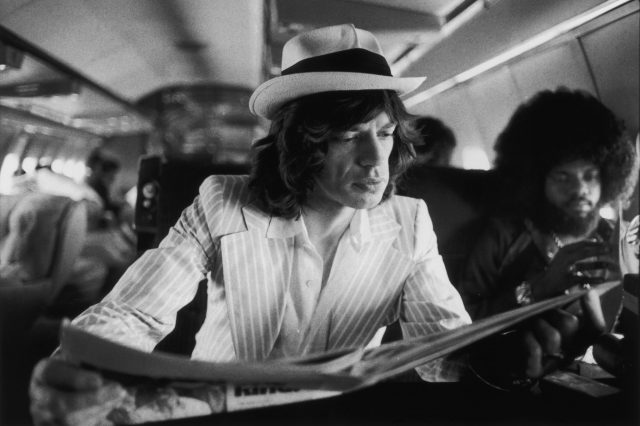 Mick Jagger reading between concerts, 1975 