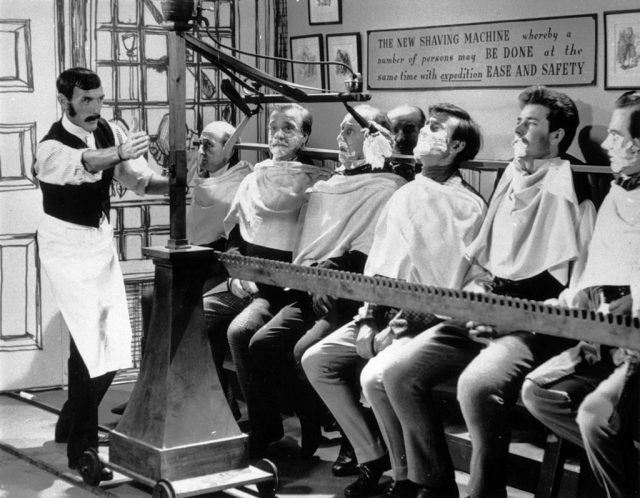 The ‘mass shaving machine’, a nineteenth century invention, which can shave a dozen men at the same time, on an untransmitted pilot show for a proposed television series called ‘brainwaves’, 28th october 1960. The series, in which unusual inventions from the 19th century were recreated, was never broadcast. (photo credit: ken howard/bips/hulton archive/getty images)