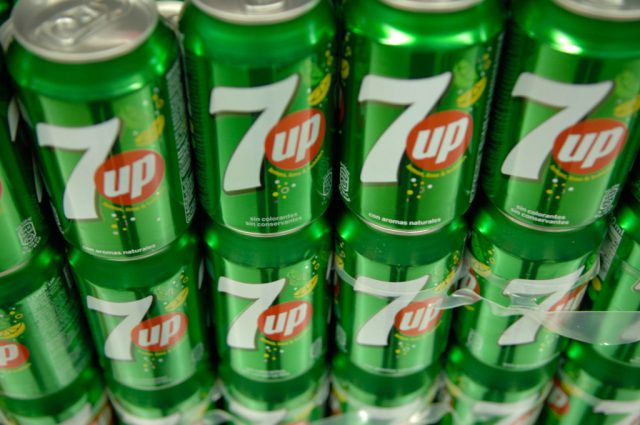 Cans of 7up stacked atop each other