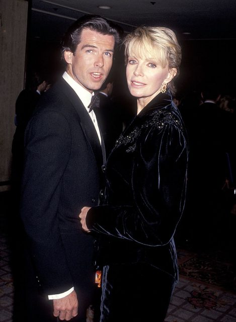 Actor pierce brosnan and wife cassandra harris attend the california fashion industry friends of aids project los angeles fifth annual fashion show & dinner benefit salute to gianni versace on february 13, 1991 (photo credit: ron galella, ltd. /ron galella collection via getty images)