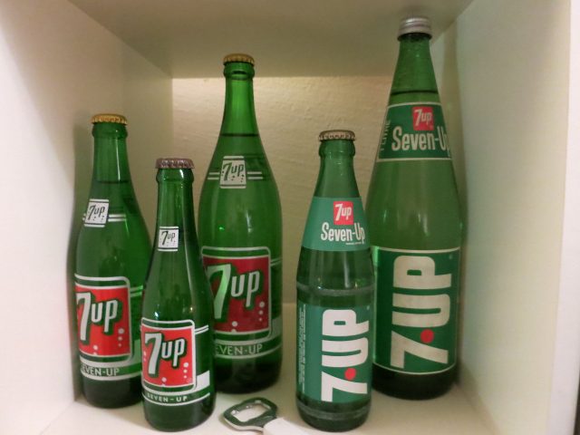 Five empty 7up bottles