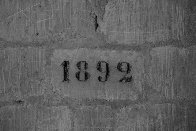 "1892" etched in stone
