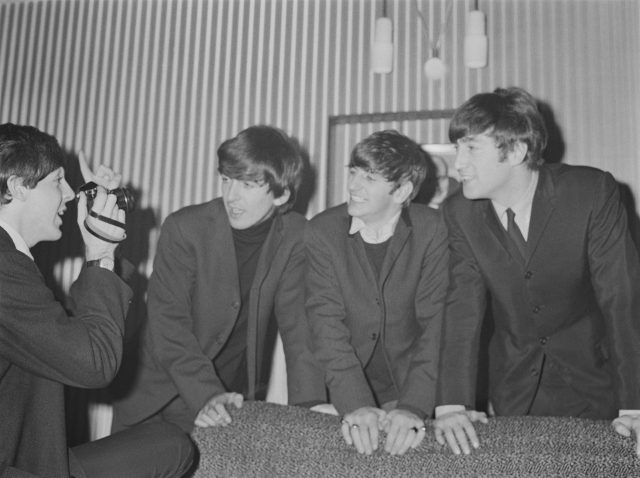 Paul Mccartney snaps of pic of the Beatles 