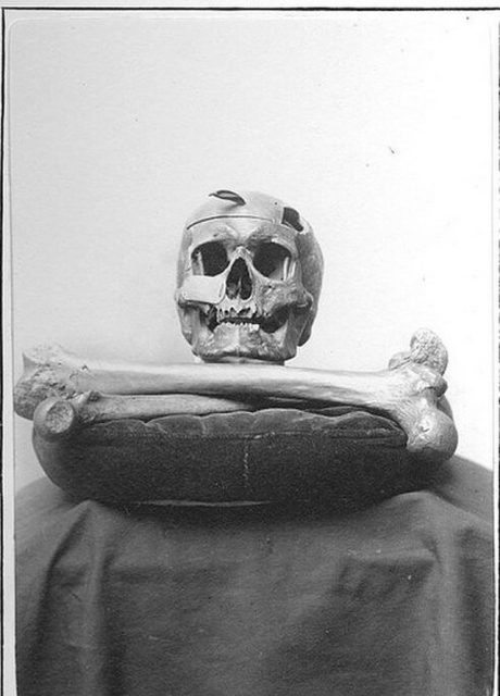 Skull and two bones atop a pillow