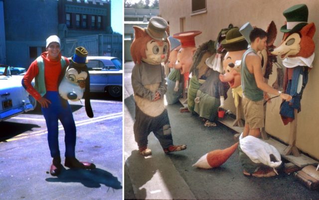 Man dressed as Goofy + Disney costumes lined up against a wall