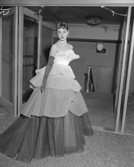 Audrey Hepburn wearing a tiered evening gown