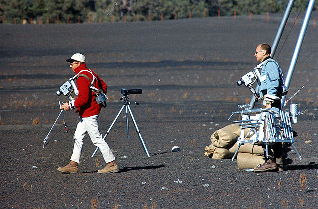 Pete Conrad and Al Bean carrying analytic tools