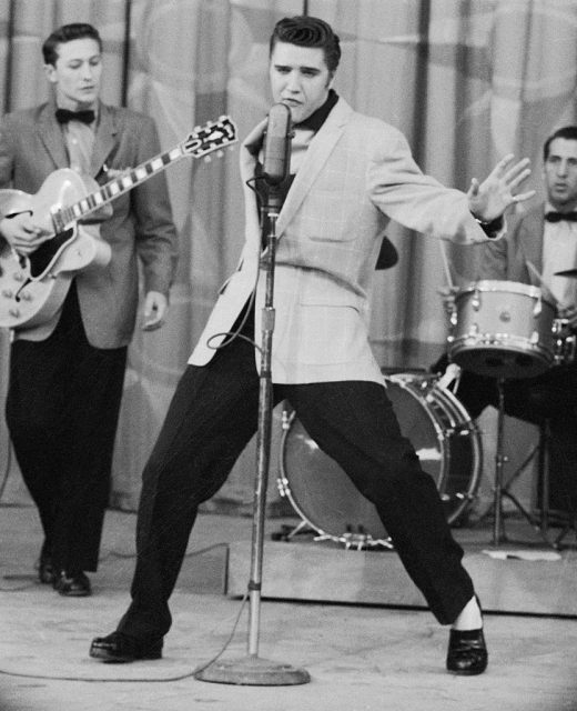 Elvis Presley performing with his backing band