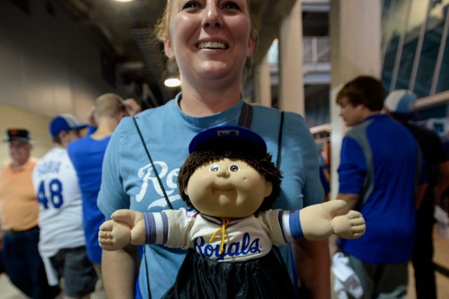 Sara Mitchell, 29, of Olathe, Kansas, carries her good luck charm “George” a Cabbage Patch doll while walking on the plaza level before Game 2 of baseball’s World Series against the Kansas City Royals  (Photo Credit: MediaNews Group/Bay Area News via Getty Images)