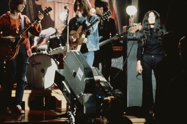 From left to right: Eric Clapton, John Lennon (1940 – 1980), Keith Richards and Yoko Ono perform live on stage as The Dirty Mac on the set of the Rolling Stones Rock and Roll Circus at Intertel TV Studio in Wembley, London, 11th December 1968. (Photo Credit: Mark and Colleen Hayward/Redferns)