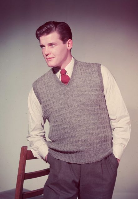 British film star Roger Moore wearing a grey tank top in his modeling days, before he found fame as The Saint and James Bond. (Photo Credit: Chaloner Woods/Getty Images)